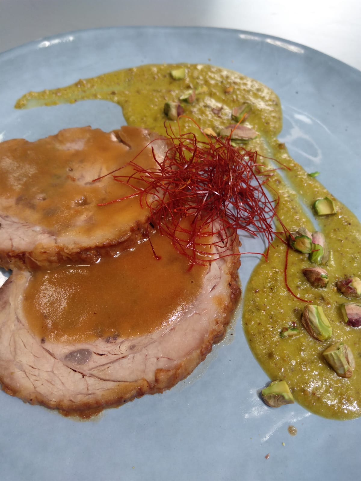 Stuffed roasted veal and pistacchio pesto