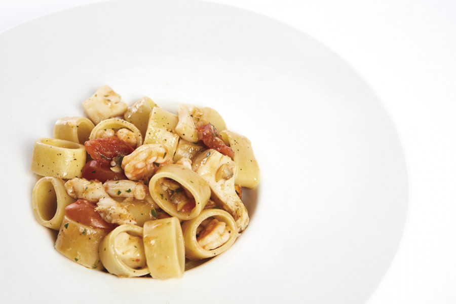 CALAMARATA PASTA WITH SEAFOOD SAUCE AND DATTERINI TOMATOES