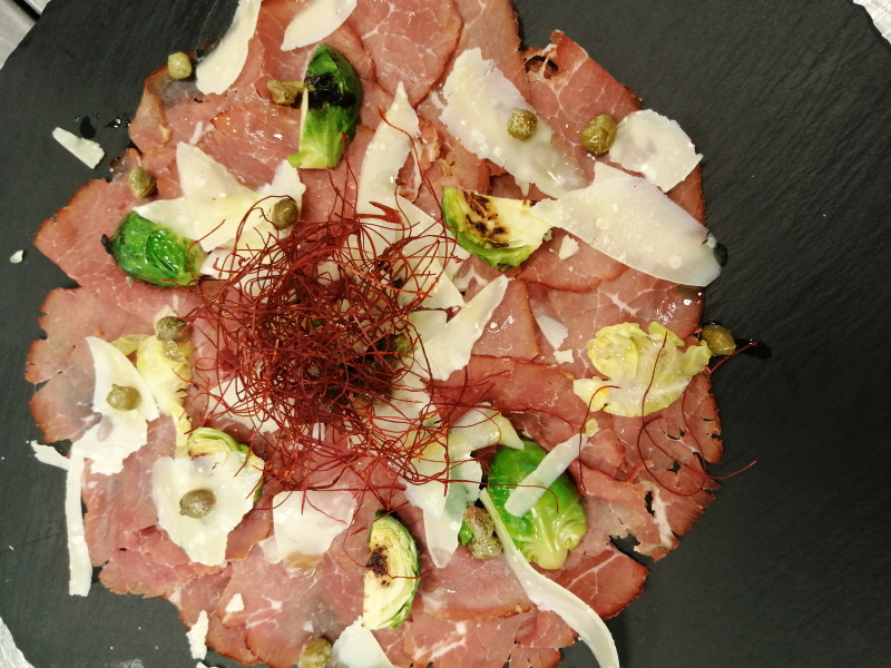 Smoked beef carpaccio, brussel sprouts, small capers and shaved parmigiano