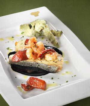 Pieces of swordfish with squid ink, shrimps, Soleggiati Sun Blushed Tomatoes and grilled artichokes