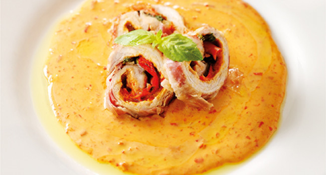 Pork fillet wrapped in pancetta with  bell pepper sauce