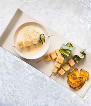 Finger food of polenta with parmigiano and porcini soup