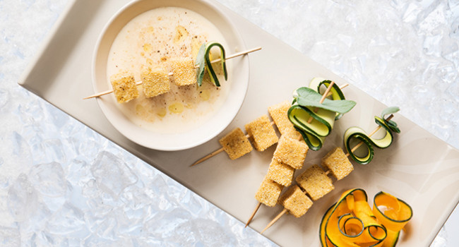 Finger food of polenta with parmigiano and porcini soup