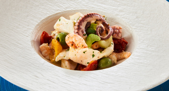 SEAFOOD SALAD WITH A BLEND OF SEMI-DRY TOMATOES AND CASTELVETRANO OLIVES
