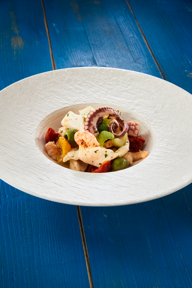 SEAFOOD SALAD WITH A BLEND OF SEMI-DRY TOMATOES AND CASTELVETRANO OLIVES