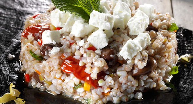 Buckwheat salad with vegetables, olives and feta