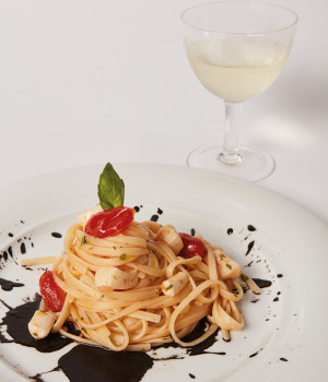 LINGUINE WITH CUTTLEFISH AND CHERRY TOMATOES ON A BED OF SQUID INK