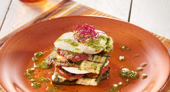 MILLEFEUILLE OF VEGETABLES WITH AUBERGINES, COURGETTES, WHEELS OF SEMI-DRIED TOMATOES AND FRESH GENOVESE PESTO