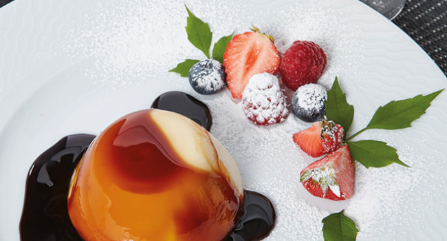 PANNA COTTA WITH CARAMEL, STRAWBERRIES AND WILD BERRIES