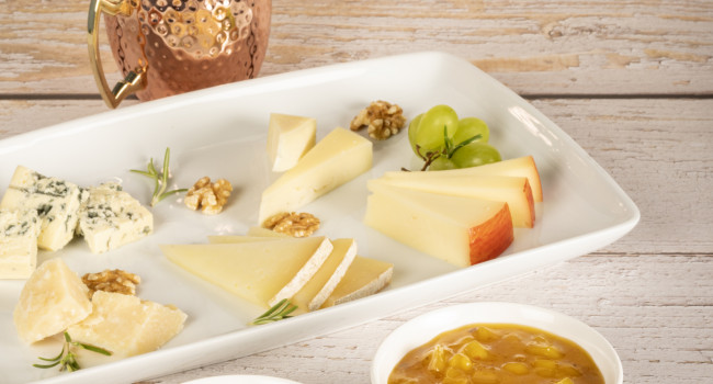 Platter of cheese with Pineapple and Sweet Pepper Chutney and Mango and Pink Pepper Chutney