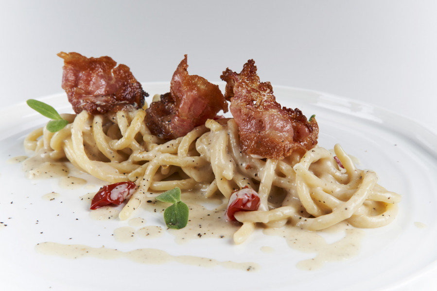 PICI PASTA WITH ÈCACIOEPEPE SAUCE,  DORATI TOMATOES AND GUANCIALE