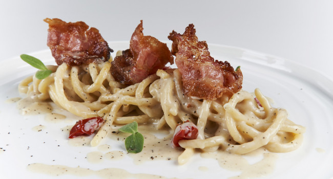 PICI PASTA WITH ÈCACIOEPEPE SAUCE,  DORATI TOMATOES AND GUANCIALE