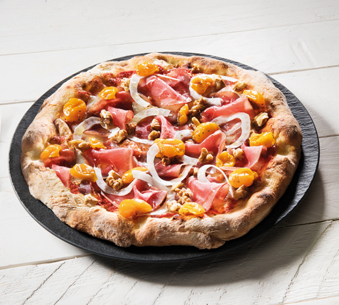 Pizza with yellow cherry tomatoes and black angus