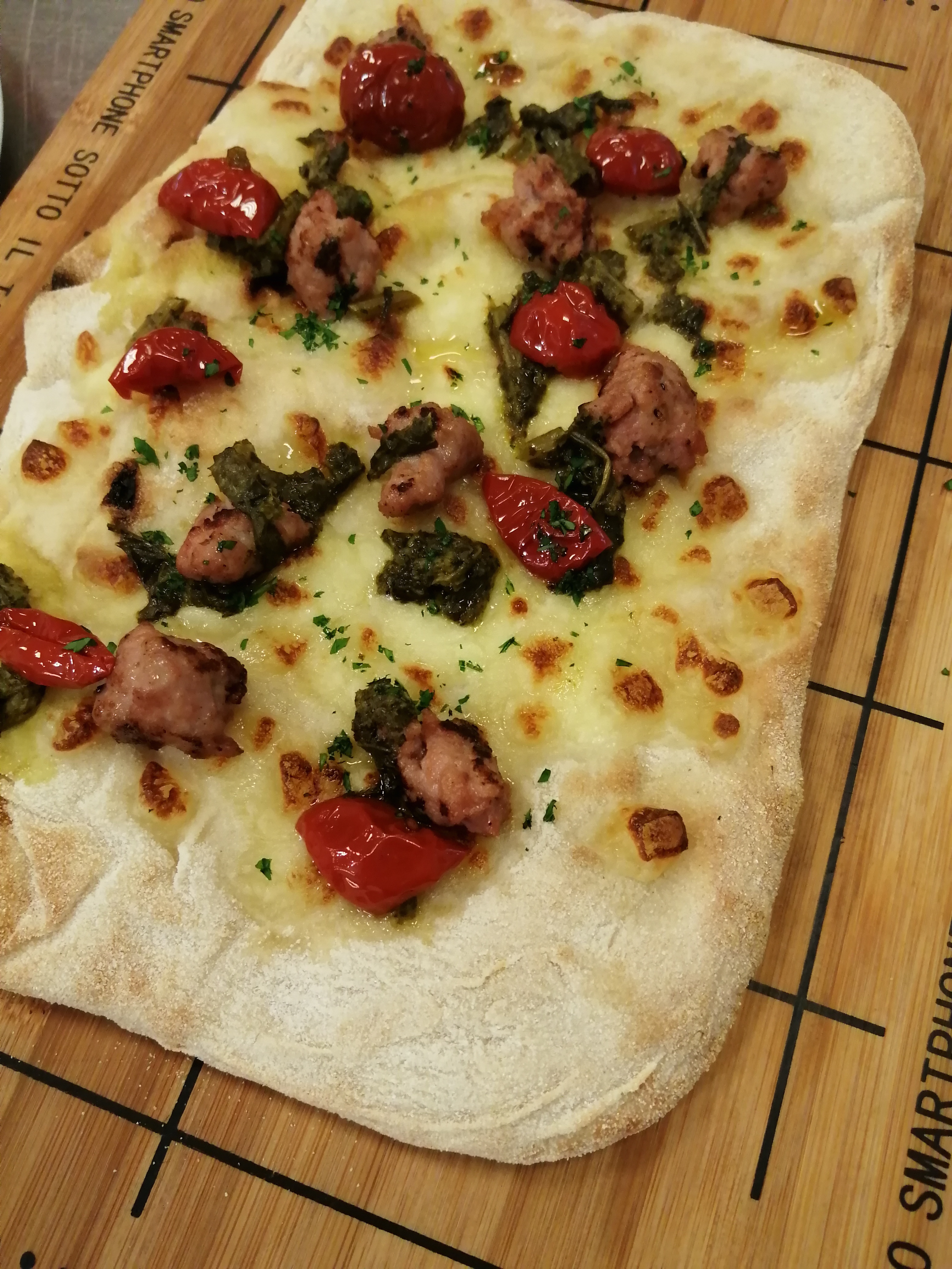 P.A.L.A. pizza with buffalo mozzarella, pecorino, sausages, friarielli and dorati