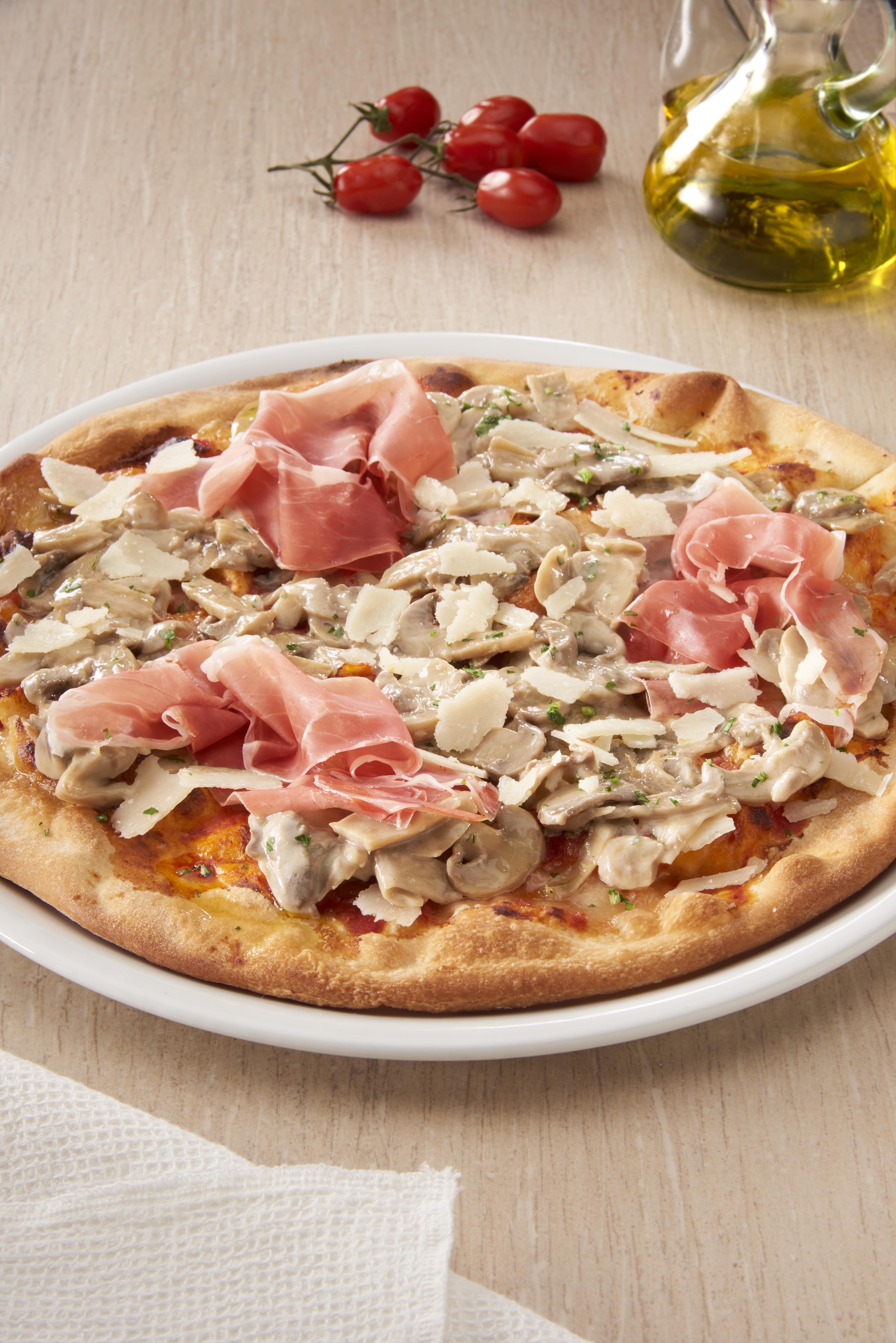 Pizza with Prosciutto, Portobello Mushrooms and shaved Parmigiano Reggiano cheese