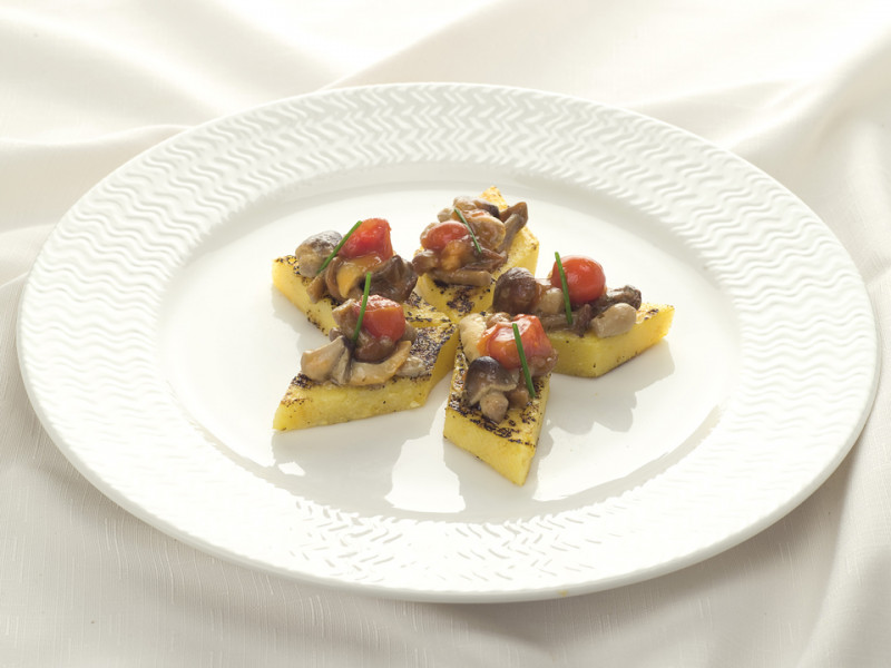 Grilled polenta with poker mushrooms and cherry tomatoes sauce