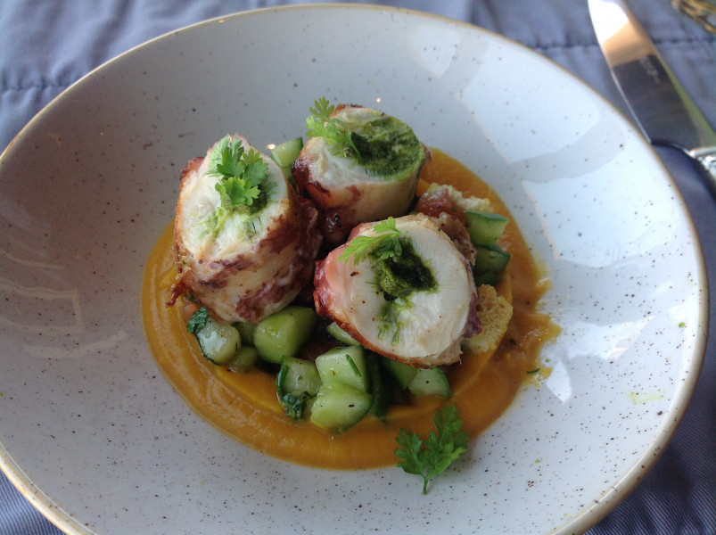 Steamed octopus, on pumpkin cream with crunchy cucumber and basil pesto