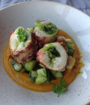 Steamed octopus, on pumpkin cream with crunchy cucumber and basil pesto
