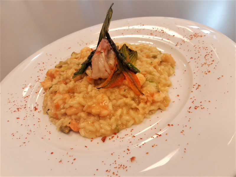 Risotto with prawns, bisque, asparagus and zucchini flowers