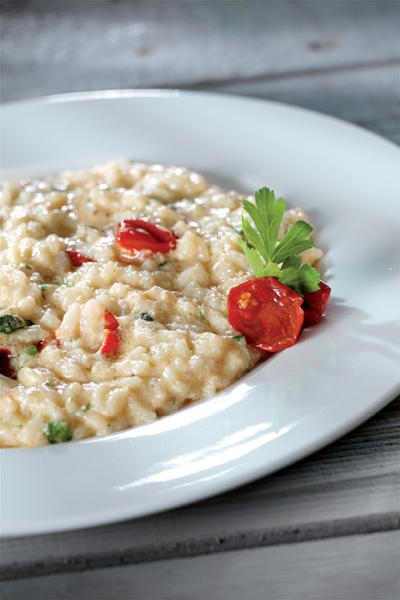 Risotto con zucchine, pomodorini e crema di scampi
