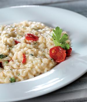 Risotto con zucchine, pomodorini e crema di scampi