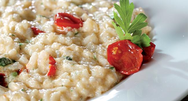 Risotto con zucchine, pomodorini e crema di scampi