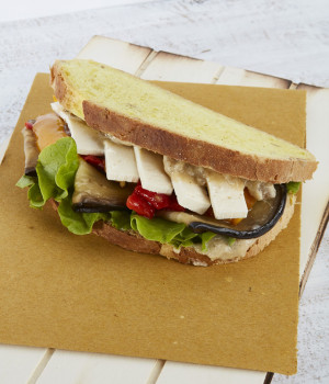 Vegan pumpkin bread sandwich with vegetables and tofu