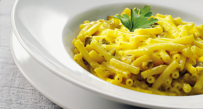 Sedanini pasta with pecorino cheese, zucchini and saffron