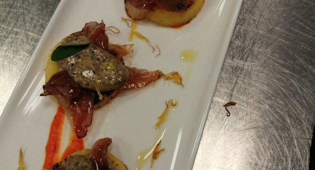 Polenta bites with black olive mayo  smoked goose and peperonata coulis