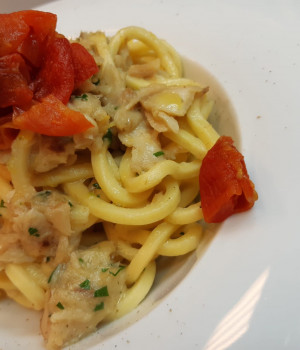 Tonnarelli pasta with grouper, mini red and lemon zest