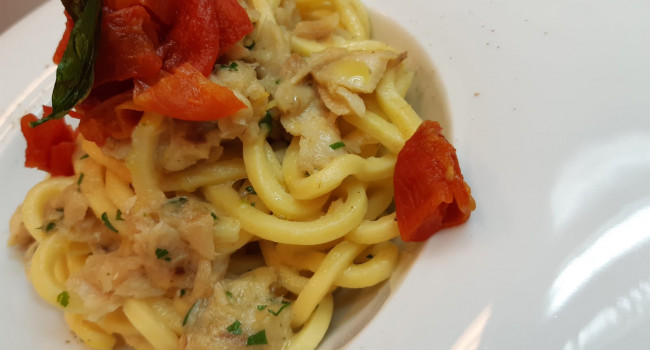 Tonnarelli pasta with grouper, mini red and lemon zest