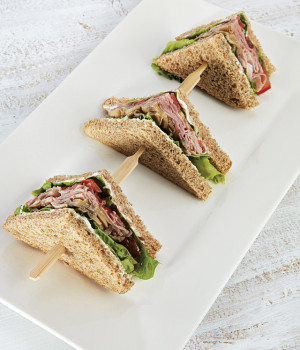 Trio of sandwiches with ham and sautéed field mushrooms