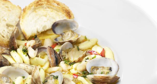 Cavatelli pasta soup with clams and cannellini beans